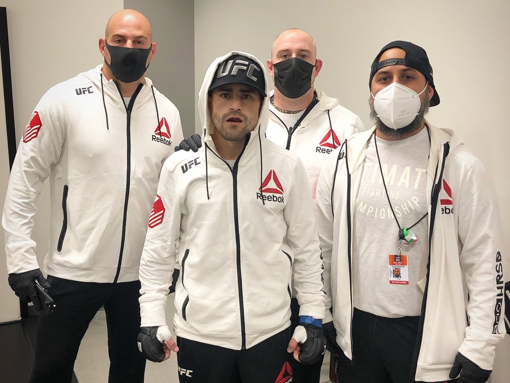 Coach Seth Stacey with Victor Rodriguez and his corner team at the UFC