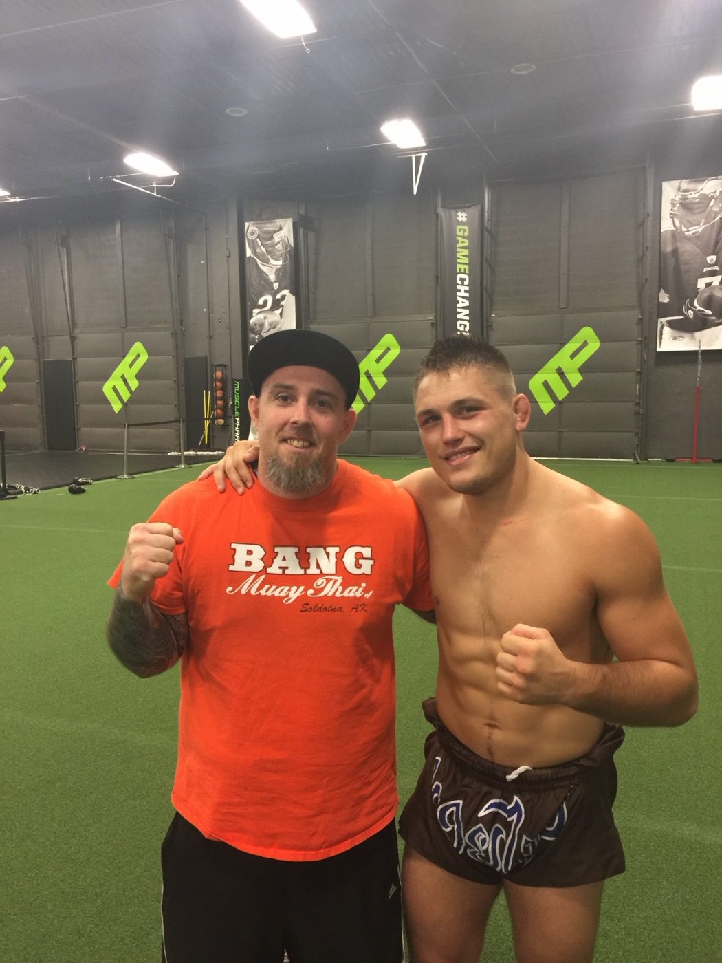 Coach Seth Stacey with a fighter